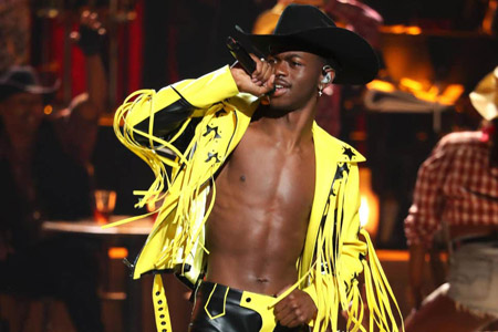 Lil Nas X performing on stage.